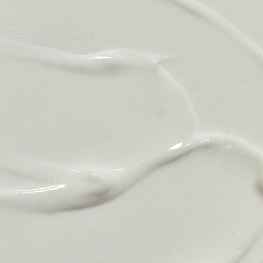 RŌZ lightweight milk serum texture on hand showing smooth slip benefit