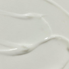 RŌZ lightweight milk serum texture on hand showing smooth slip benefit