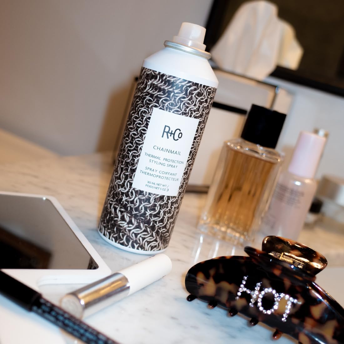 R+Co Chainmail ingredient detail with oils and extracts highlighting nourishment