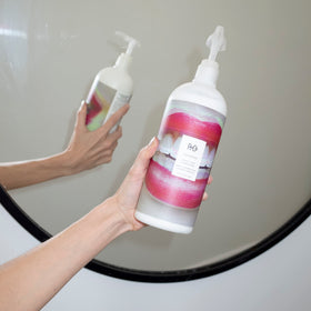 R+Co Television conditioner creamy pour texture demonstrating fast absorption and lightweight moisture