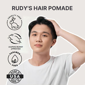 Hands applying Rudy's pomade demonstrating effortless distribution and control