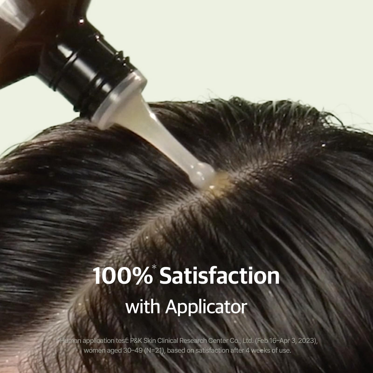 RYO bottle in hand applying serum at roots demonstrating easy mess-free use