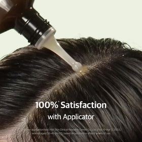 RYO bottle in hand applying serum at roots demonstrating easy mess-free use
