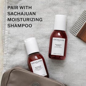 SACHAJUAN conditioner being applied in shower for frizz control benefit