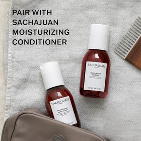 SACHAJUAN shampoo in use under shower showing smooth manageable hair benefit