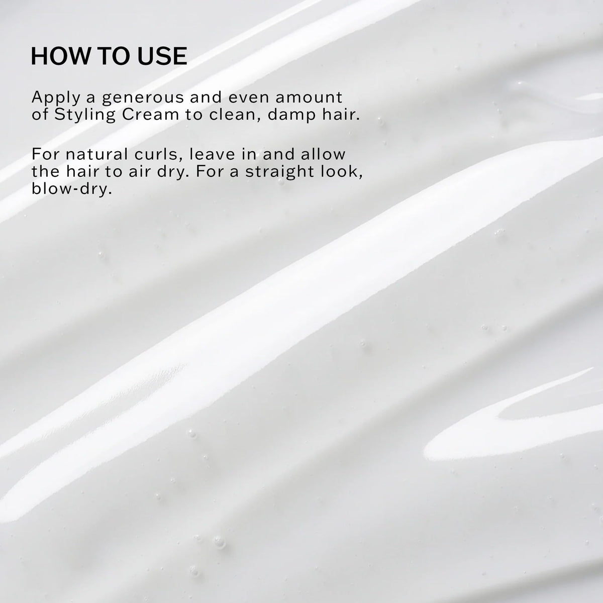 SACHAJUAN styling cream dispensed on hand demonstrating easy spreadability