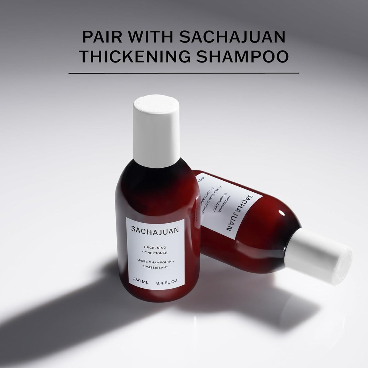 SACHAJUAN bottle in hand to show 8.4 fl oz size and travel-friendly benefit