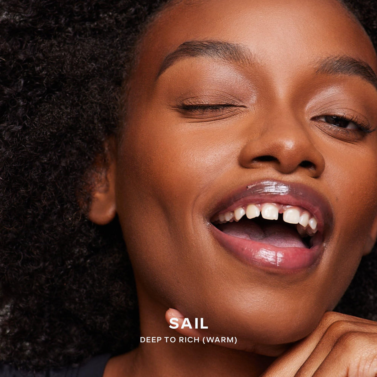 Saie Dew Bronze applying to cheek showing targeted sculpting for natural definition