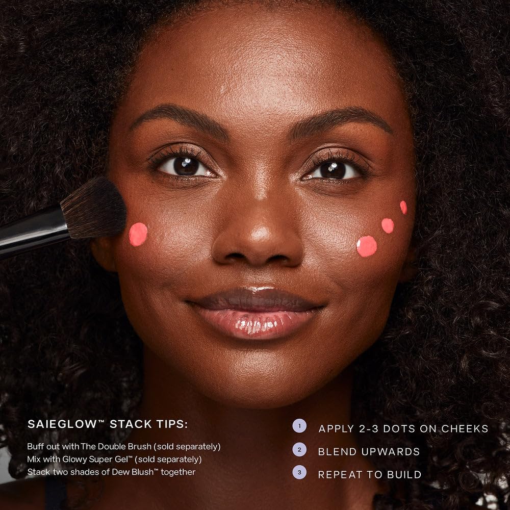Saie applying blush to cheek with finger for natural, dewy color