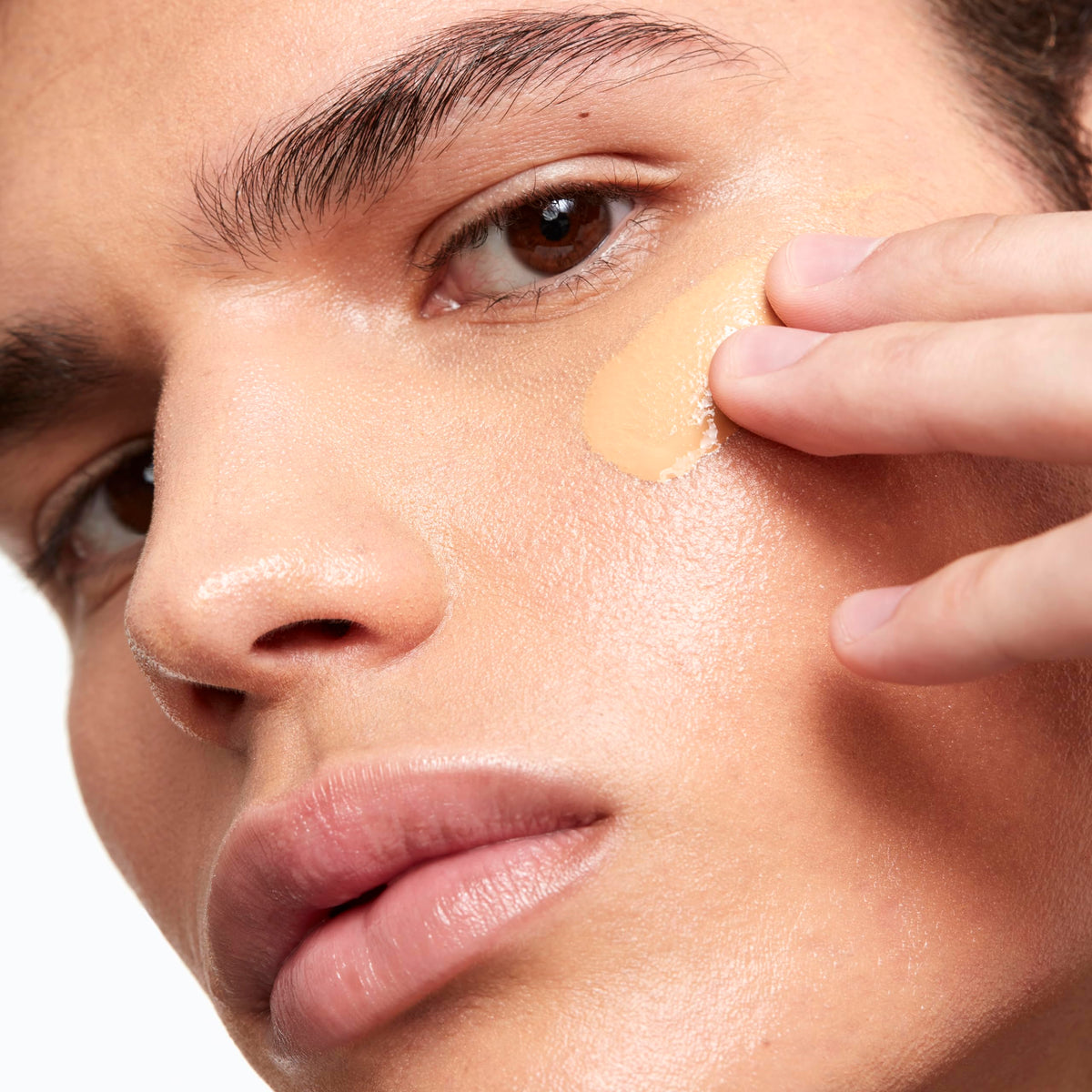 Saie texture close-up of dewy serum-pigment blend, shows luminous finish
