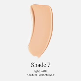 Saie Glowy Super Skin Tint texture drop close-up highlighting dewy finish