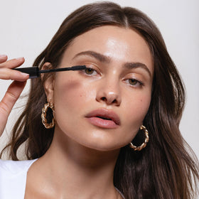 Saie lifestyle application on model showing lifted lashes and everyday wear look