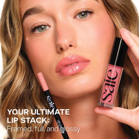 Saie lip liner in hand for scale showing compact travel-friendly size