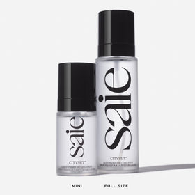 Saie mini CitySet placed on a vanity with makeup for everyday finishing benefits