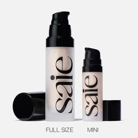 Saie beside a coin to show 0.5 oz size and convenient travel-friendly volume