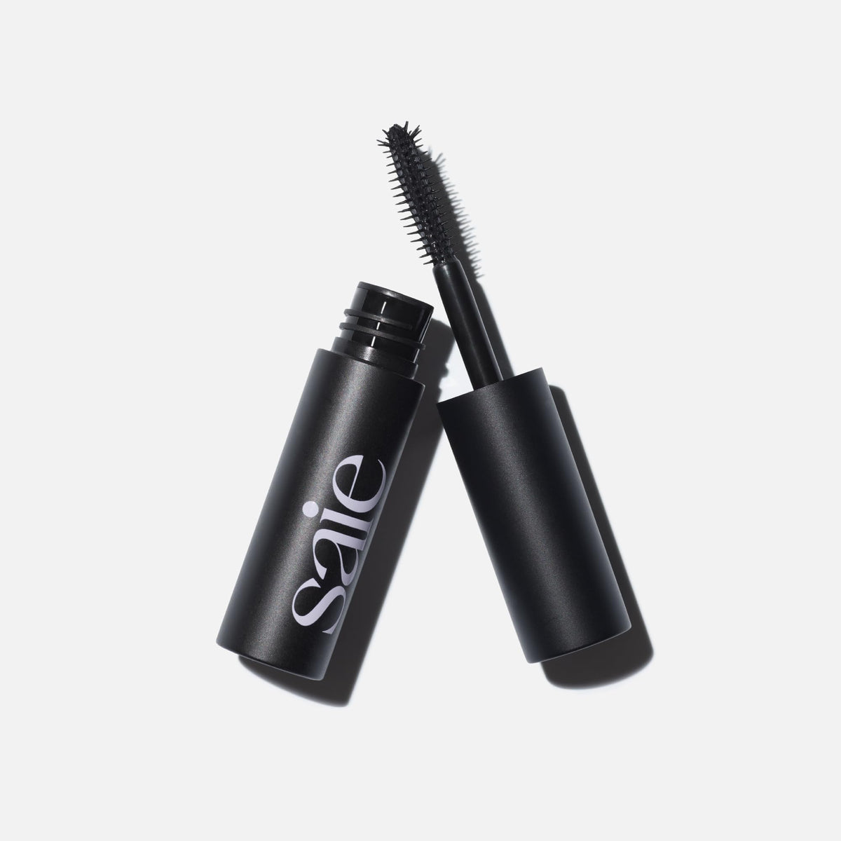 Saie mini mascara applying to upper lashes for instant lift and length benefit