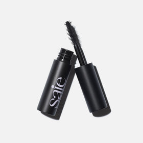 Saie mini mascara applying to upper lashes for instant lift and length benefit