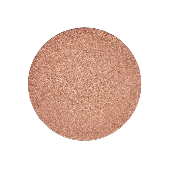 Saie Quartzglow front pan view showing warm bronze refill and sustainable design