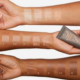 Saie Slip Tint applied on medium‑tan model illustrating Shade Six golden undertones