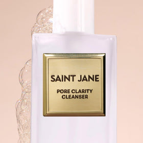 SAINT JANE floral ingredients flatlay with botanicals and clarity benefit