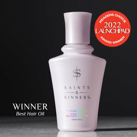 Saints & Sinners serum texture on hand highlighting lightweight iridescent finish benefit