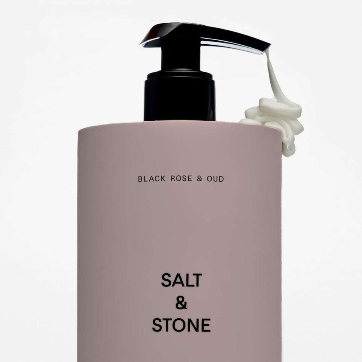 Salt & Stone bottle styled on bathroom shelf for everyday grooming routine appeal