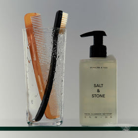 Salt & Stone bottle staged on bathroom shelf suggests daily routine benefit