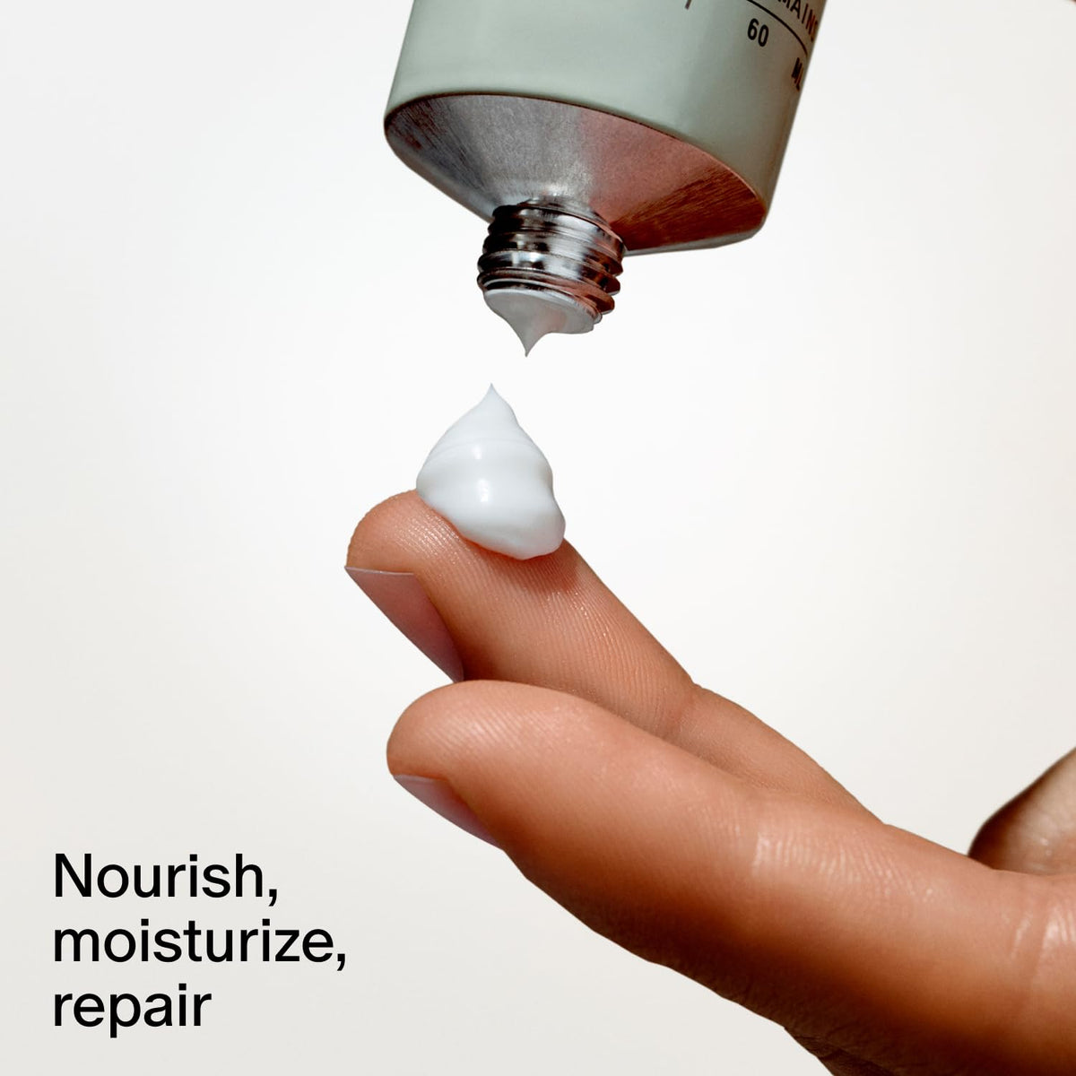 Salt & Stone tube next to phone showing 2 fl oz portability for travel convenience