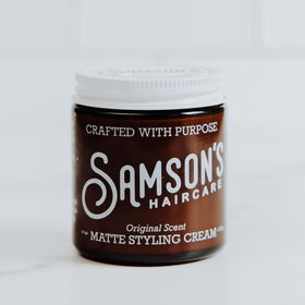 SAMSON'S HAIRCARE close-up of cream texture showing matte, non-greasy finish benefit
