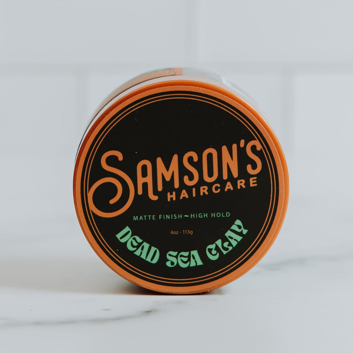 SAMSON'S HAIRCARE close-up of clay texture demonstrating grippy mineral finish