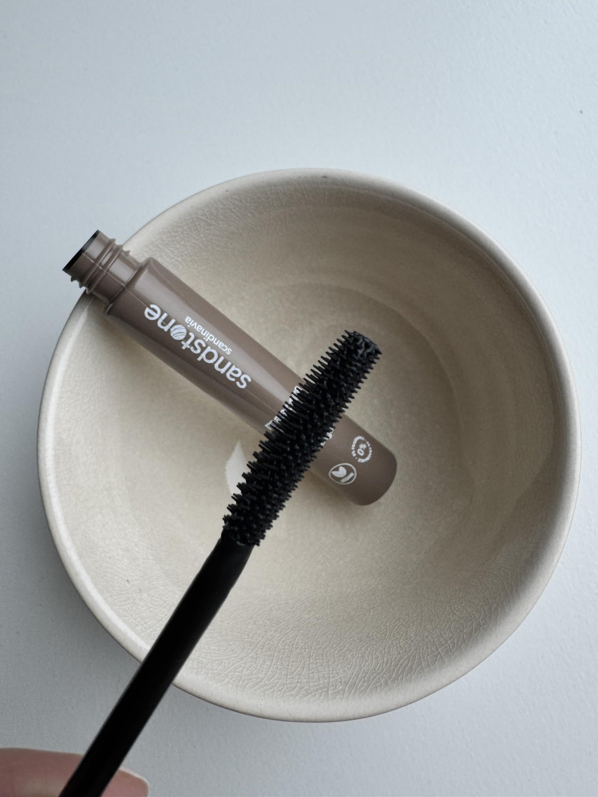 Sandstone Scandinavia mascara displayed with contact lenses reassuring gentleness