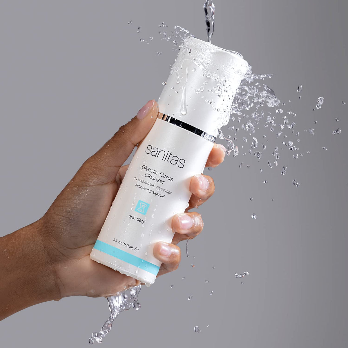 Sanitas bottle in hand showing scale and easy pump use for convenient daily cleansing