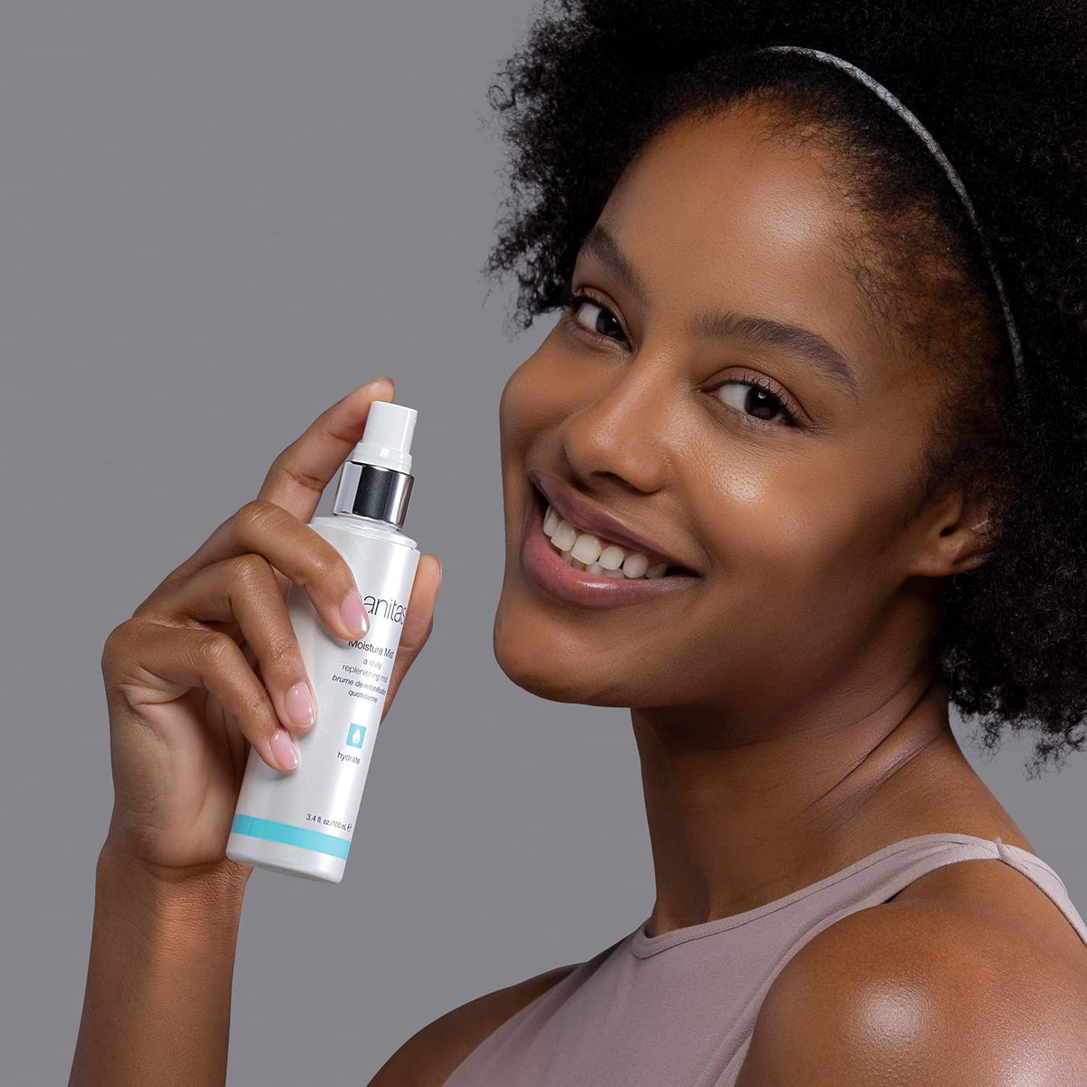 Sanitas spray mist being applied to face for instant hydration boost