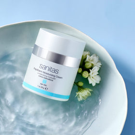 Sanitas cream applied on hand demonstrating lightweight absorption and glow