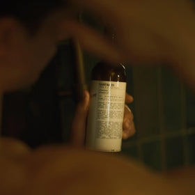 Santal 33 LeLabo ingredients label highlighting Vitamin E and Aloe Vera benefits