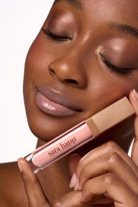 Sara Happ on-model lips showing ballet pink finish and high-impact glossy look benefit