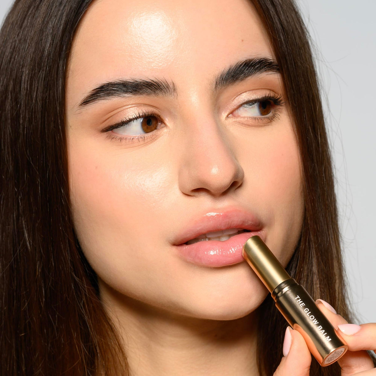 Sara Happ balm on lips showing glossy finish and hydrated look