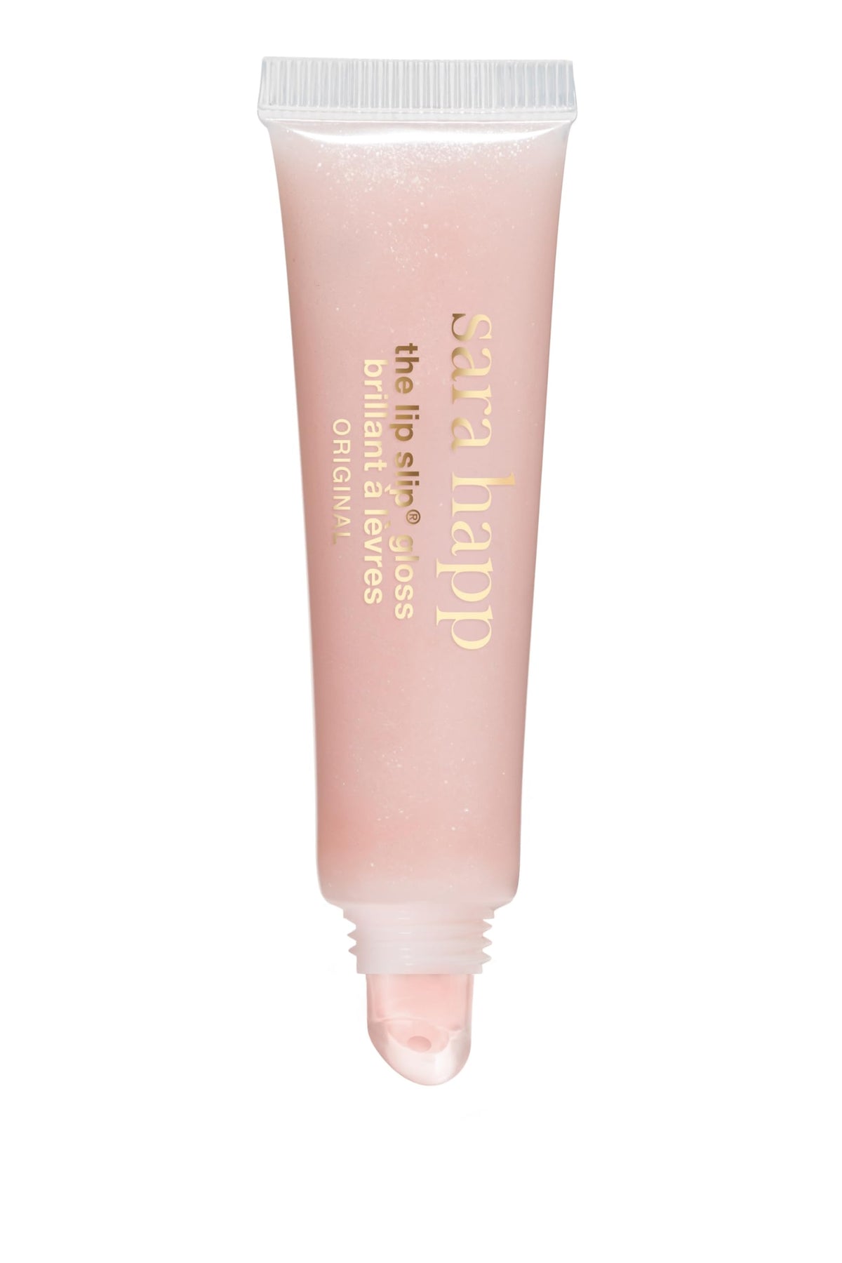 Sara Happ gloss on vanity with flowers showing luxury scent and everyday elegance benefit
