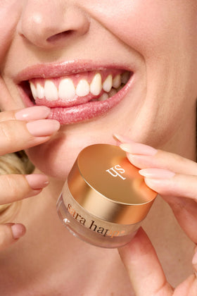 Sara Happ vanilla bean in use applying scrub to lips to gently exfoliate and prep for balm