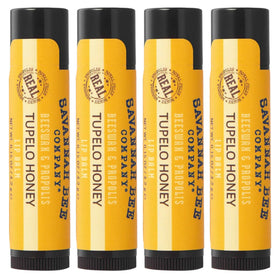 Savannah Bee Company tins front view showing four tupelo honey lip balms and portability benefit