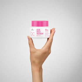 Schwarzkopf Professional open jar revealing creamy emulsion that indicates rich repair benefits
