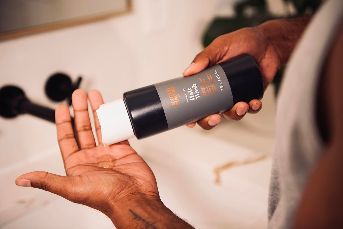 Scotch Porter shampoo being dispensed into hand to show easy, controlled use