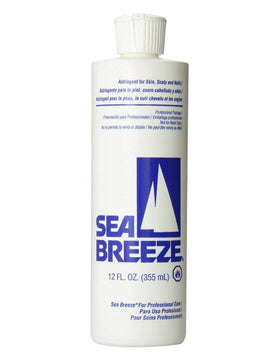 Seabreeze bottle held in hand to show 12 oz scale and portable grooming convenience