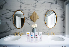 SEBAMED bottle in bathroom setting conveying daily use convenience and travel-ready size