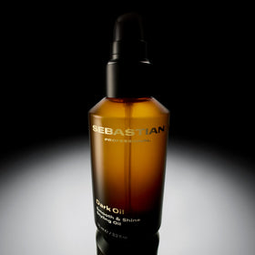 Close-up of finished hair shine after Sebastian Dark Oil application showing reflective gloss