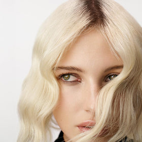 Sebastian No Breaker being applied to damp hair demonstrating bond-building and frizz control
