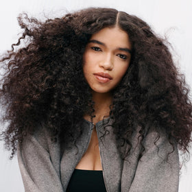 Sebastian Penetraitt before-and-after photo of hair ends showing reduced frizz