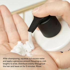 SEEN applying mask to damp hair, demonstrates easy five-minute application