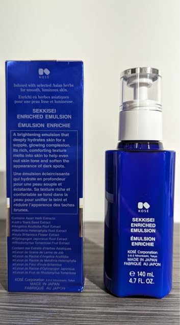 Hands pressing SEKKISEI emulsion into skin for visible softness
