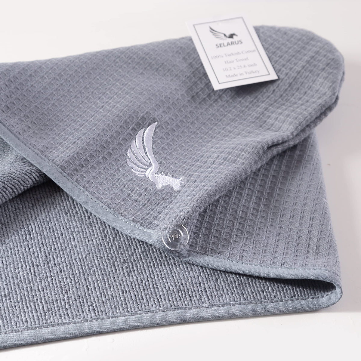 SELARUS towel flat lay with travel items showing convenient travel benefit